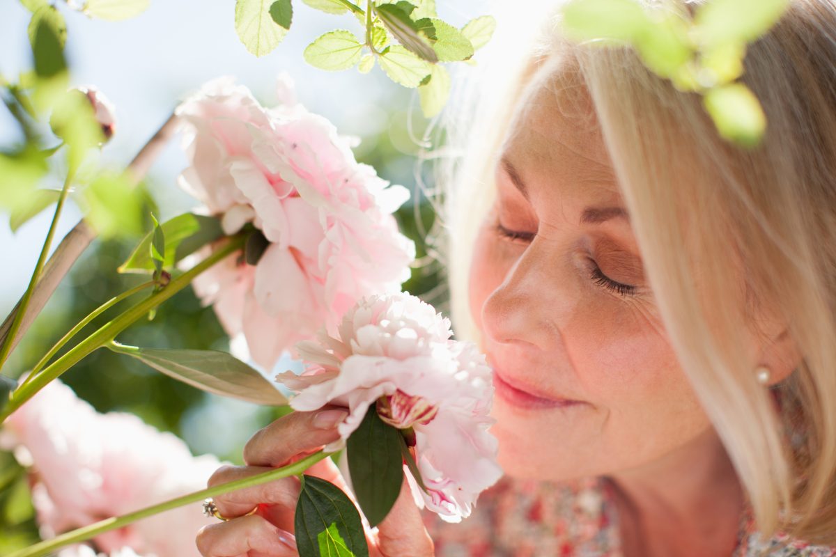 Woman smelling flowers